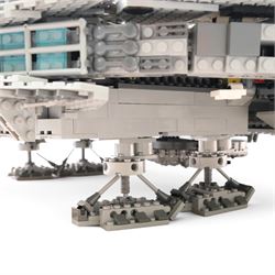 Three Lepin Star Wnrs built models, comprising Red Five X-Wing Starfighter no. 05039, Millennium Falcon no. 05132 and Super Star Destroyer no. 05028