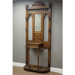  Early 20th century oak hall stand, central bevelled mirror above carved panel, hinged compartment, turned supports with stick and umbrella stands, W85cm, H215cm, D34cm  