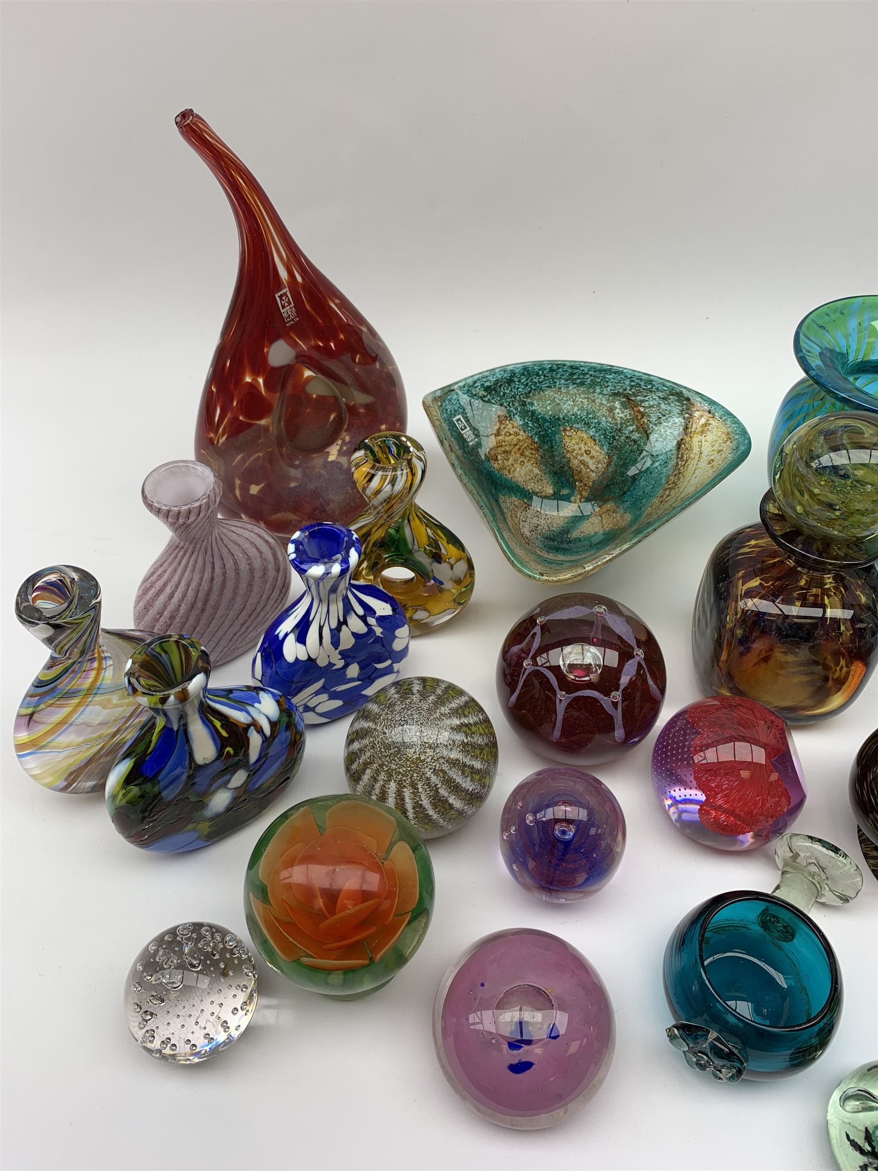 Mdina glass comprising a sculptural glass paperweight, bottle and stopper, vase of teardrop form, two vases and a dish, together with various paperweights including Caithness, vases etc 