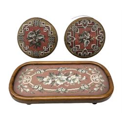 Pair of Victorian beadwork footstools of circular form with a beaded and needlework upholstery, together with a victorian needlework tray with a glass cover, footstool D30cm