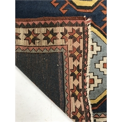 Turkish blue ground rug, three central medallions, 197cm x 134cm