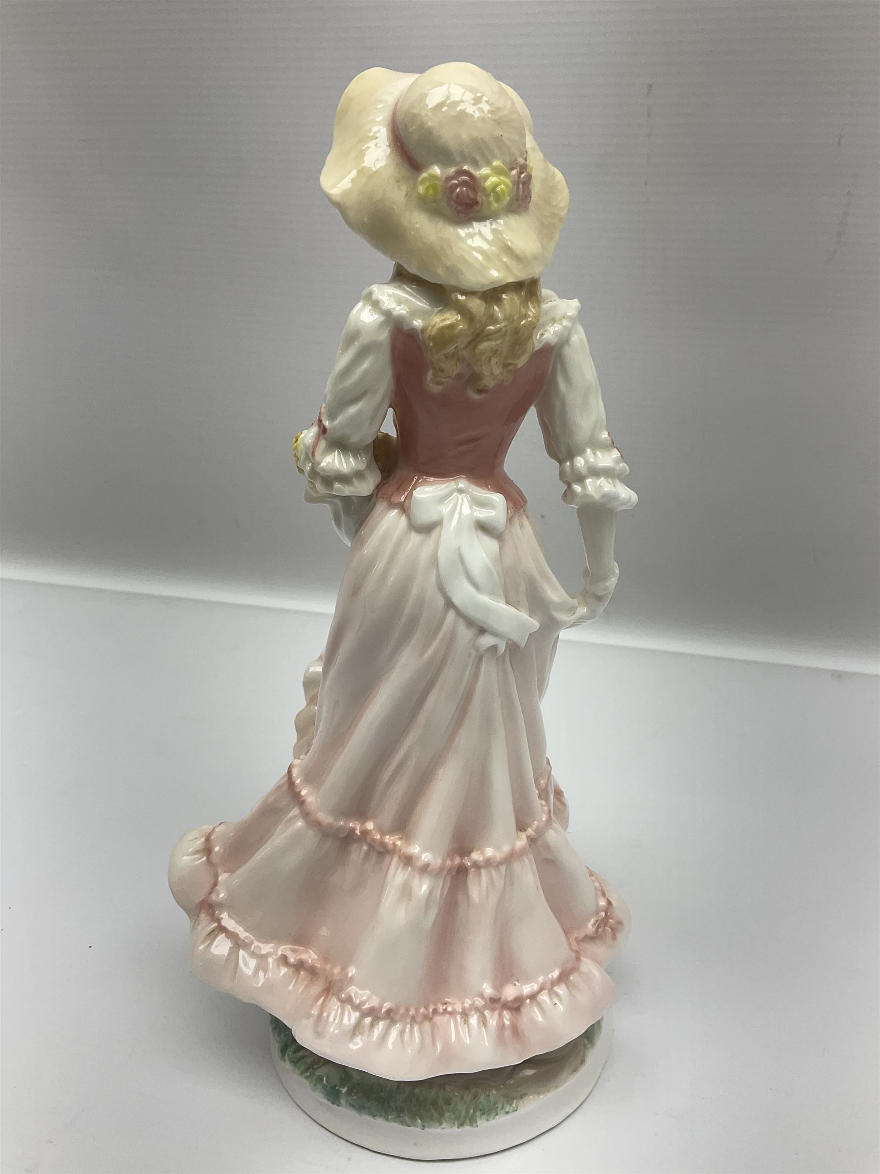 Two Royal Worcester figures, comprising Spirit of the Millennium and Spring, together with Royal Dux figure of two lovers