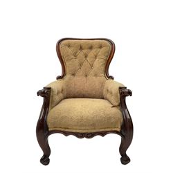 Victorian mahogany upholstered armchair, moulded framed, scroll carved arm terminals on scrolled cabriole supports, shaped carved apron