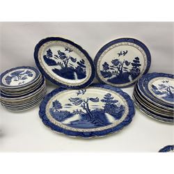 Booths Real Old Willow pattern part tea and dinner service, to include two meat platters, cake stand, teapot, two jugs, sugar bowl, sauce boat, teacups and saucers and a collection of plates and bowls