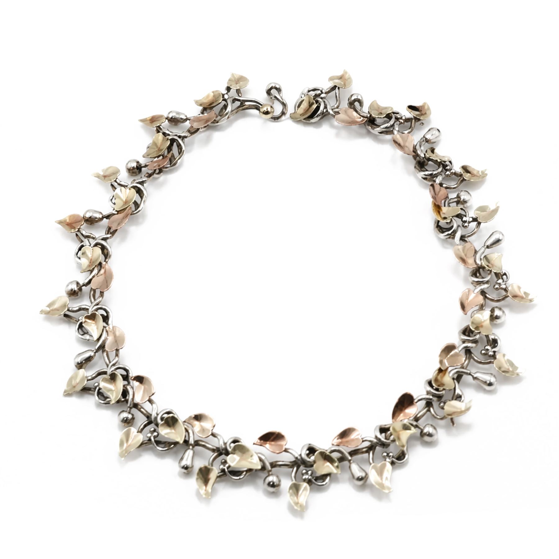 Brett Payne silver and 9ct gold fruiting vine necklace, seventeen links with alternating pears and apples and 9ct gold leaves, Sheffield 1998, boxed