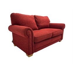 Two seat metal actions sofa bed upholstered in red cover