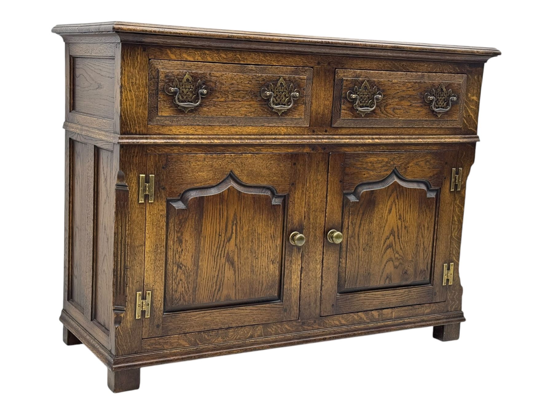 Early 20th century Jacobean design oak dresser sideboard, rectangular top with moulded edge over two baize-lined drawers with pierced handles, above two fielded panel cupboard doors, on stile supports