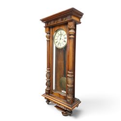19th century mahogany Vienna Regulator wall clock, carved mahogany framed with turned and half-canted pilasters, over a lobed terminal
