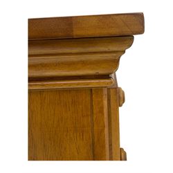 Pair of contemporary cherry wood bedside chests, rectangular top and projecting moulded cornice over three drawers, on plinth base with shaped apron