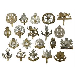 Twenty cap badges including Hertfordshire, Royal Sussex, Cambridgeshire, Hampshire, Notts and Derby, East Surrey, Herefordshire, South Lancashire, Devonshire, Bedfordshire, Durham Light Infantry etc (20)