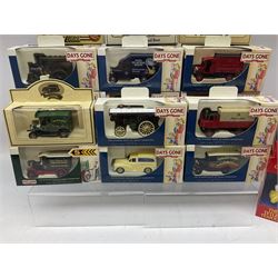 Twenty-two modern die-cast models by Days Gone, Lledo, Vanguards etc; boxed; twelve Tetley promotional figures and houses; boxed; and quantity of unboxed modern die-cast models
