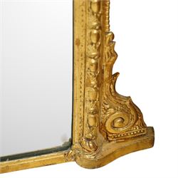 Victorian giltwood rococo revival overmantel mirror, arched top with plume crest of scrolling acanthus leaves flanked by symmetrical foliate scrolls 