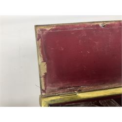 Collection of victorian and later brass desk accessories, to include a letter holder with cherub design, ink well of square form with hinged lid, brass table bell, brass casket with relief decoration, etc  