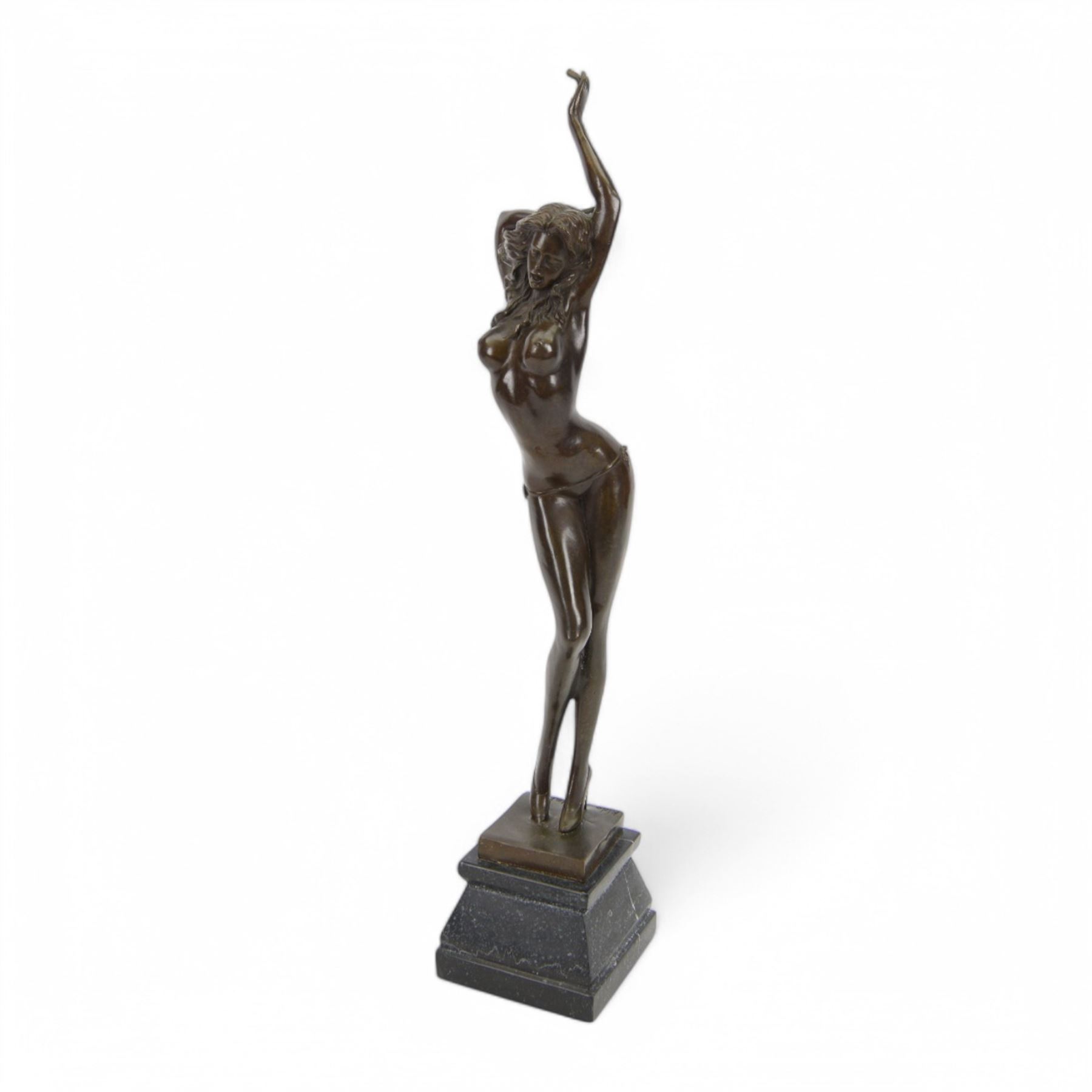 Bronze figure of a dancing nude female after Aldo Vitaleh, with signature to base, upon a black marble effect plinth, H55cm