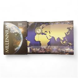 Mostly commemorative coinage, including various Queen Elizabeth II crowns, The Royal Mint United Kingdom 1999 silver proof five pounds, Canada 1999 one ounce fine sliver five dollars, Bermuda 2000 two dollars, Guyana 2000 two-thousand dollars, New Zealand 2000 ten dollars etc, housed in a coin display case and loose