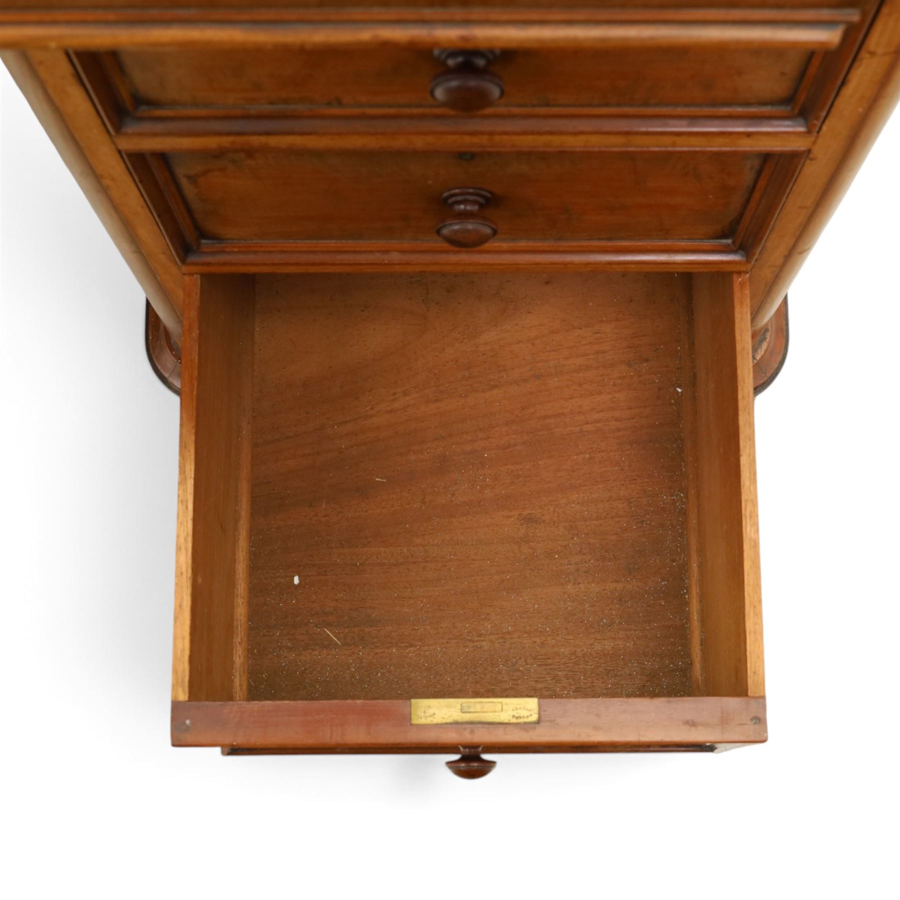Victorian mahogany twin pedestal cylinder desk, with roll top with fitted interior and with leather writing slide, raised on pedestals with three graduating drawers, raised on a plinth base with castors