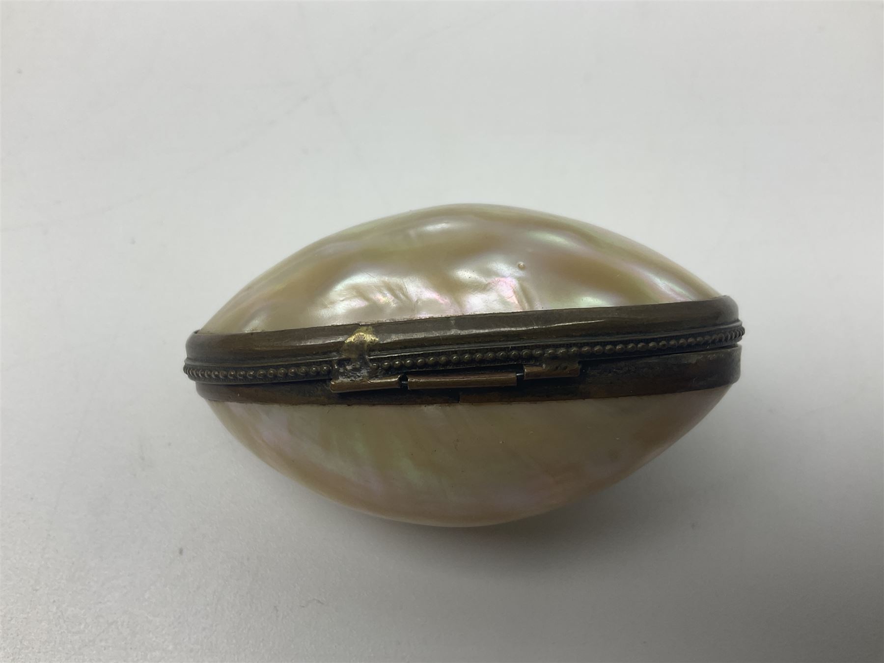 19th century lacquer thimble case with painted portrait of a woman to the hinged lid, together with two mother of pearl egg shaped thimble cases and one other