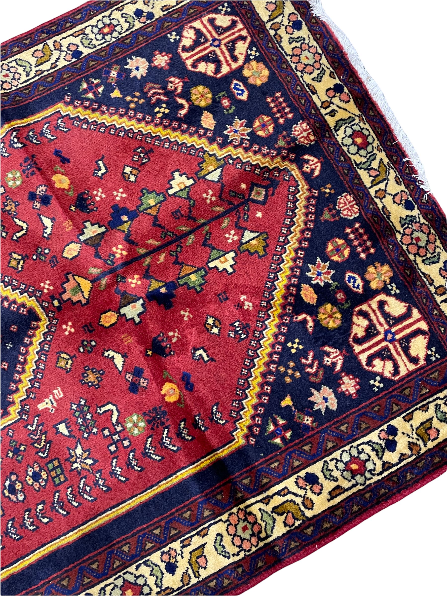 Small Persian Abadeh rug, blue ground with red lozenge field decorated with small bird and plant motifs, triple band border with floral design