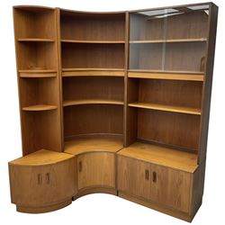 G-Plan - teak three sectional wall unit, fitted with display cabinet enclosed by two sliding glass doors, shelves and cupboards