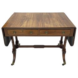 George III mahogany sofa table, rectangular drop-leaf top with reed moulded edge and rounded corners, fitted with two frieze drawers and two opposing false drawers, quadruple collar turned pillar supports on turned and block platforms, splayed and moulded supports with brass cups and castors 