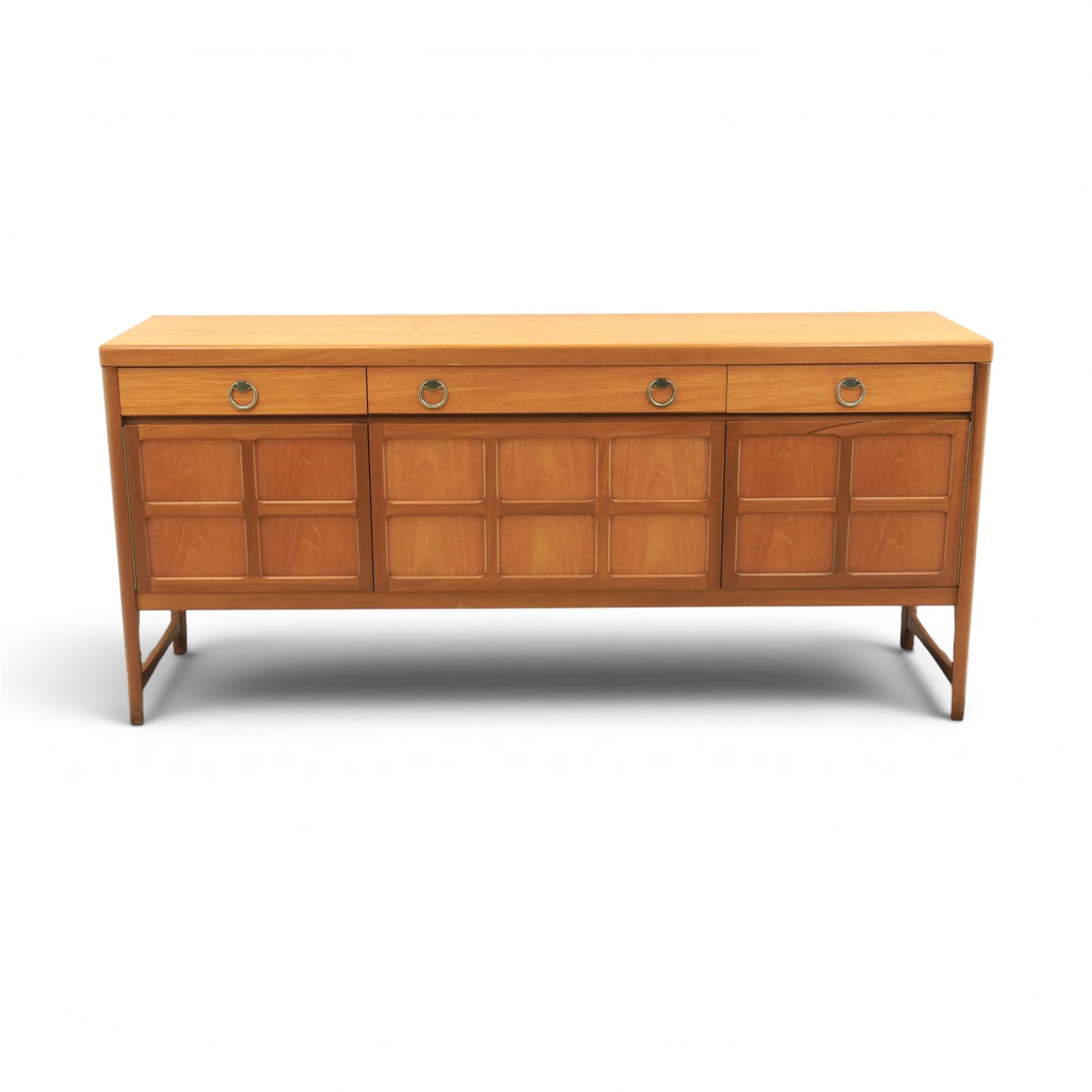 Nathan - 'Squares' mid 20th century teak sideboard, fitted with three drawers with brass ring handles, above a central fall front cabinet, flanked by two cupboard doors, raised on square tapering supports