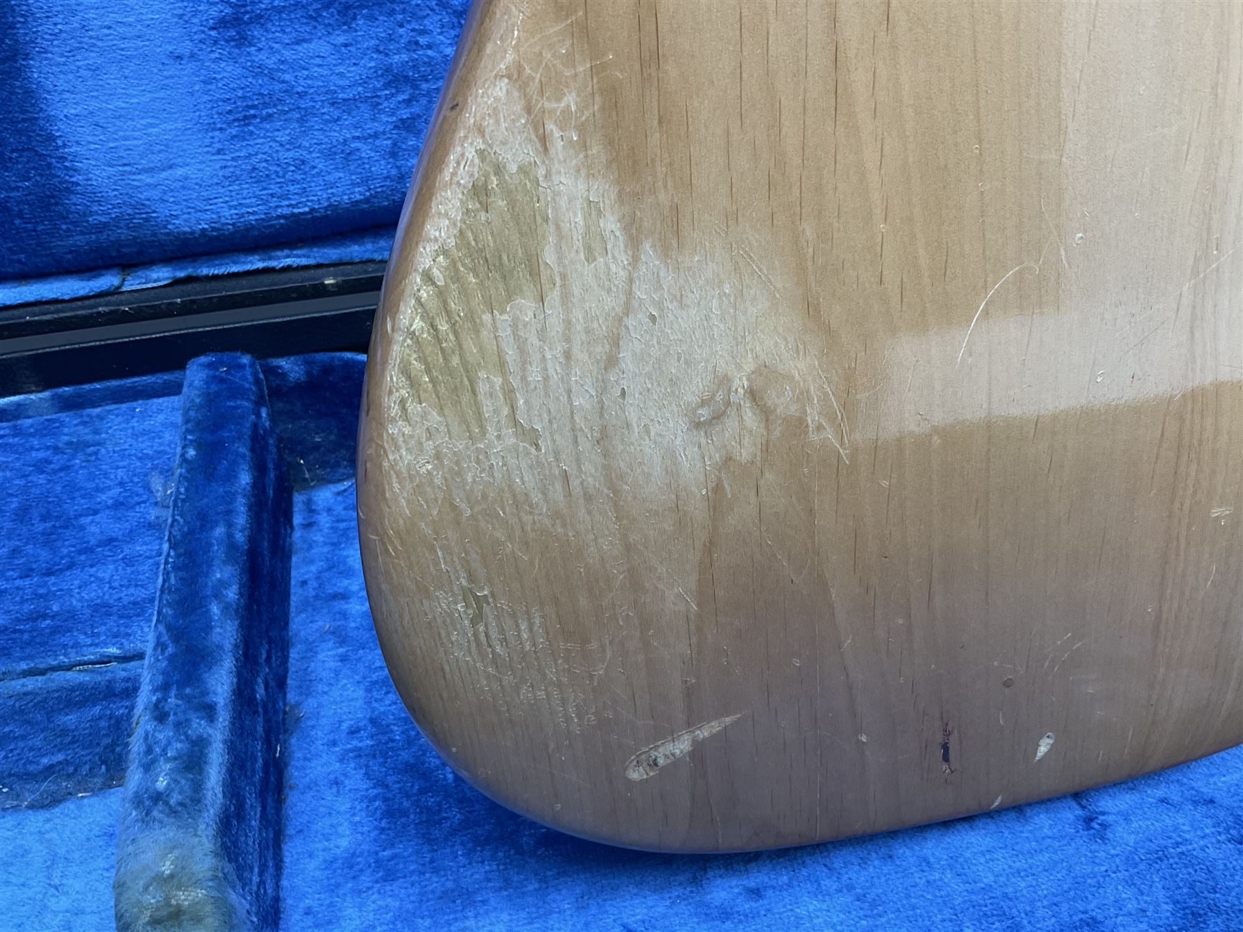 1962 Fender Precision bass guitar; re-finished in natural alder in the 1970s; impressed date code 5NOV62C to end of neck and serial no.90537 to back plate; L115.5cm; in replacement hard carrying case