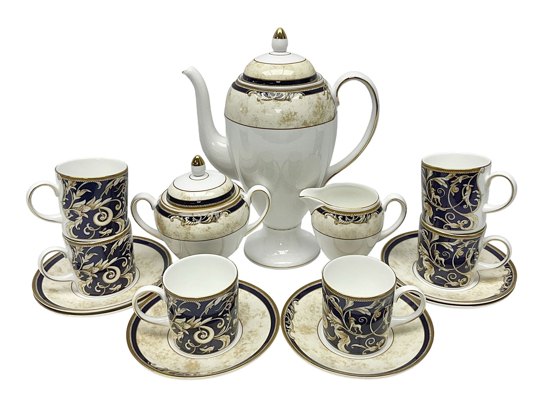 Wedgwood Cornucopia coffee service for six, comprising coffee pot, milk jug, twin handled covered sucrier, coffee cans and saucers