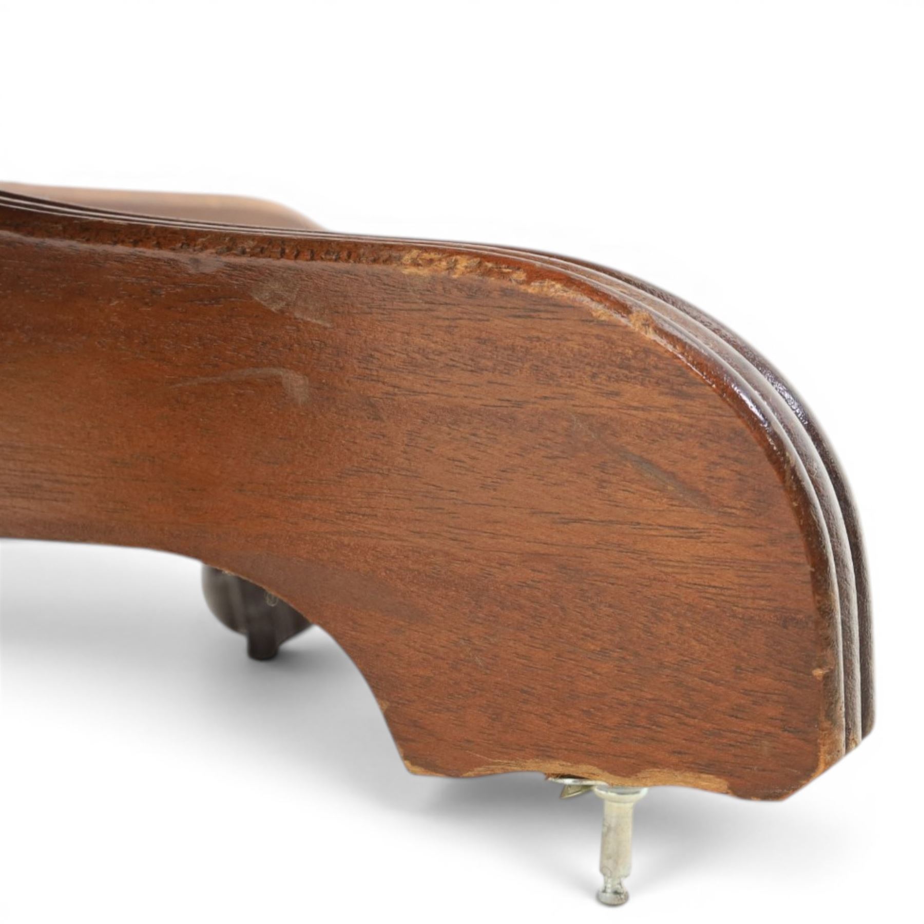 Captains swivel desk chair upholstered in oxblood leather, buttoned back and seat, shaped arm bow raised on turned spindles, five spoke base raised on castors