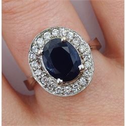 White gold oval sapphire and diamond cluster ring, stamped 14K, sapphire approx 2.00 carat