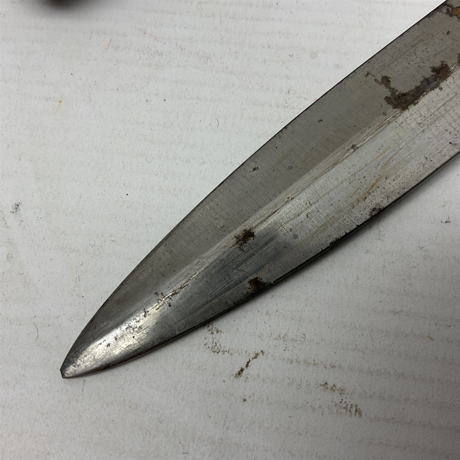 British Pattern 1888 knife bayonet, the 30.5cm double edged blade with raised central medial ridge; in leather covered scabbard L40.5cm overall