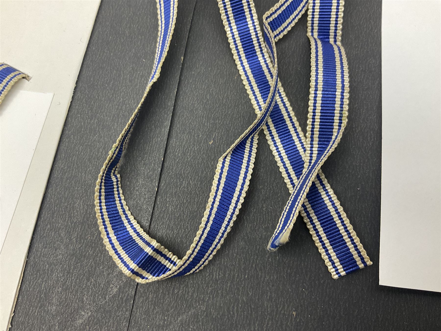 WWII set of three German Mother's Crosses, 1st Class in gilt, 2nd Class in silver and 3rd Class in bronze; all with ribbons (3)