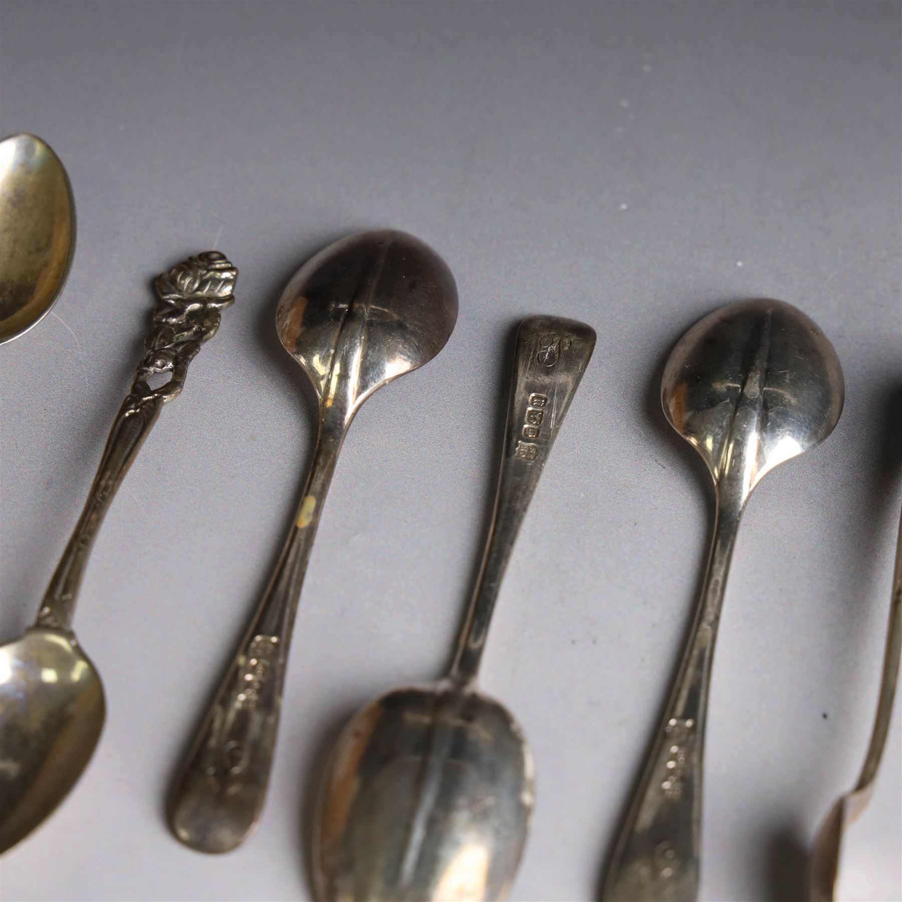 Set of six continental 800 silver coffee spoons with pierced rose design finials, stamped 800 verso, together with a cased set of six teaspoons and sugar tongs, with rattail bowls and engraved initials verso, hallmarked Cooper Brothers & Sons Ltd, Sheffield 1912, 