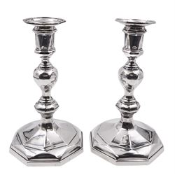 Pair of George V silver mounted candlesticks, each of knopped and facetted form, with conforming removable nozzles, hallmarked Thomas Bradbury & Sons Ltd, London 1913, H18cm