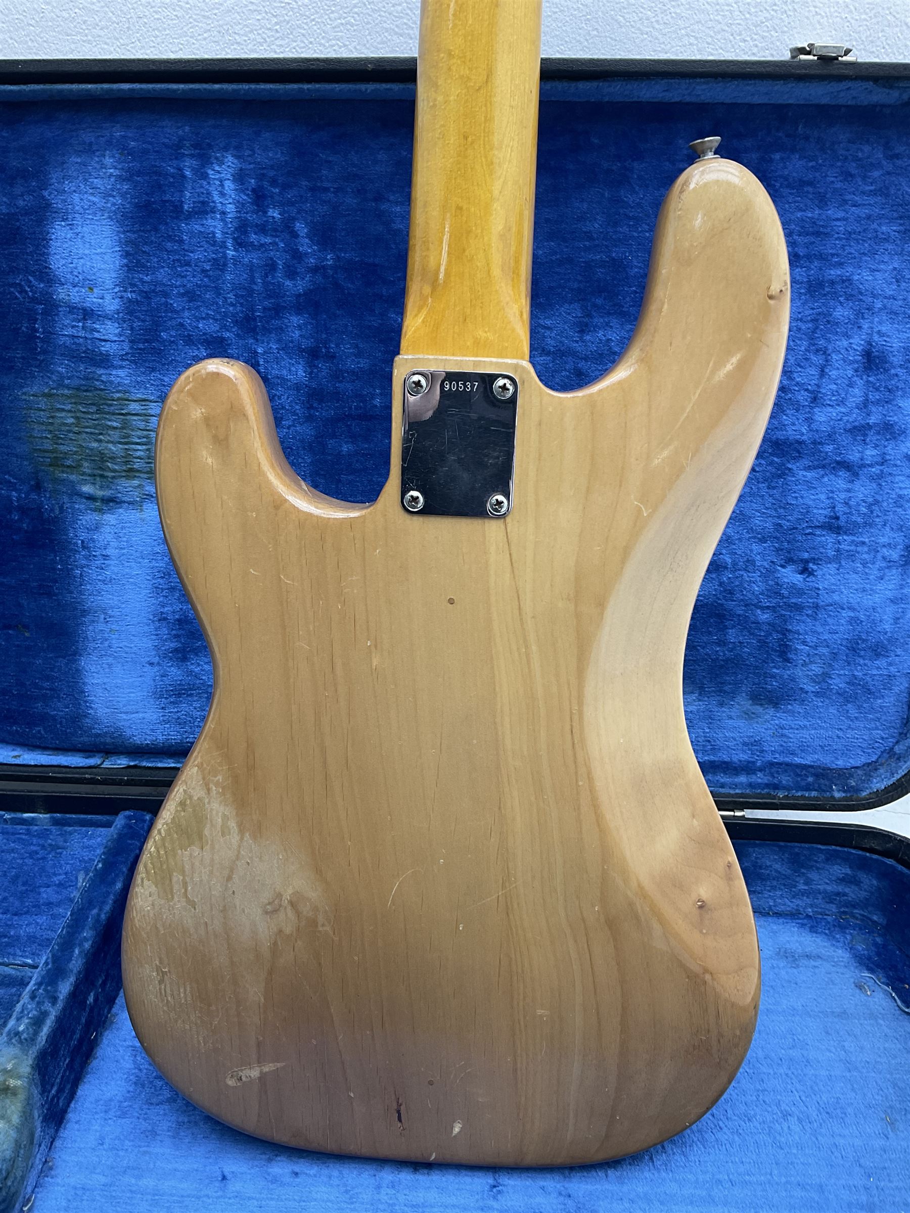 1962 Fender Precision bass guitar; re-finished in natural alder in the 1970s; impressed date code 5NOV62C to end of neck and serial no.90537 to back plate; L115.5cm; in replacement hard carrying case
