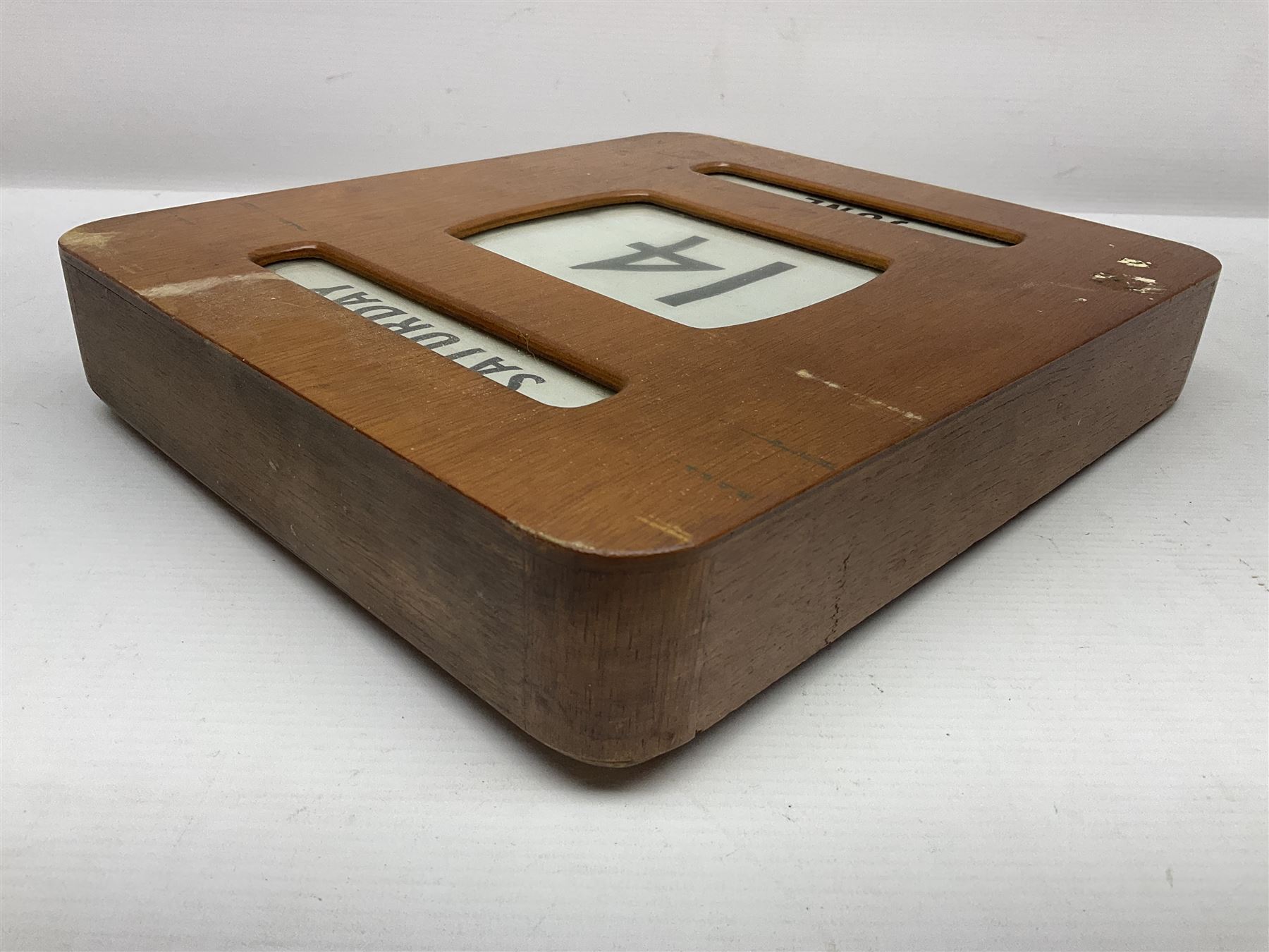 Wooden wall mounted perpetual calendar with printed rollers and chrome plated knobs to side, H30cm W27cm