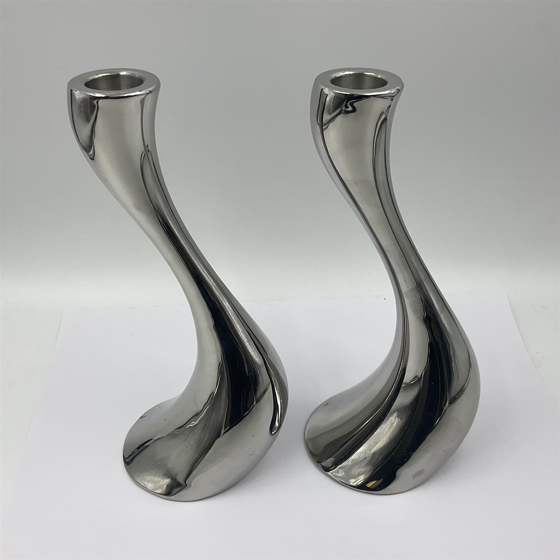 Pair of Georg Jensen chrome 'Cobra' candlesticks, with stamped maker's mark to base, H20cm
