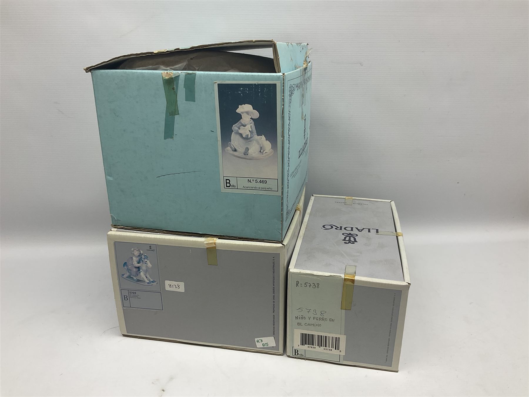 Three Lladro figures, Faithful Steed no 5769, Best Foot Forward no 5738 and Lambkins no 5469, all with original boxes, largest example H21cm 