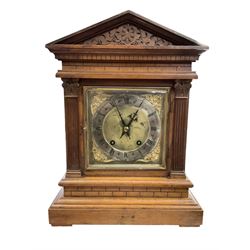 Winterhalder & Hofmeier - late 19th century Mahogany 8-day twin train mantle clock , with an architectural pediment  and carved tympanum, carved reeded pilaster to the front on a stepped plinth with  brickwork relief, square brass dial with cherub spandrels, matted dial centre and silvered chapter ring, dial pinned to a 