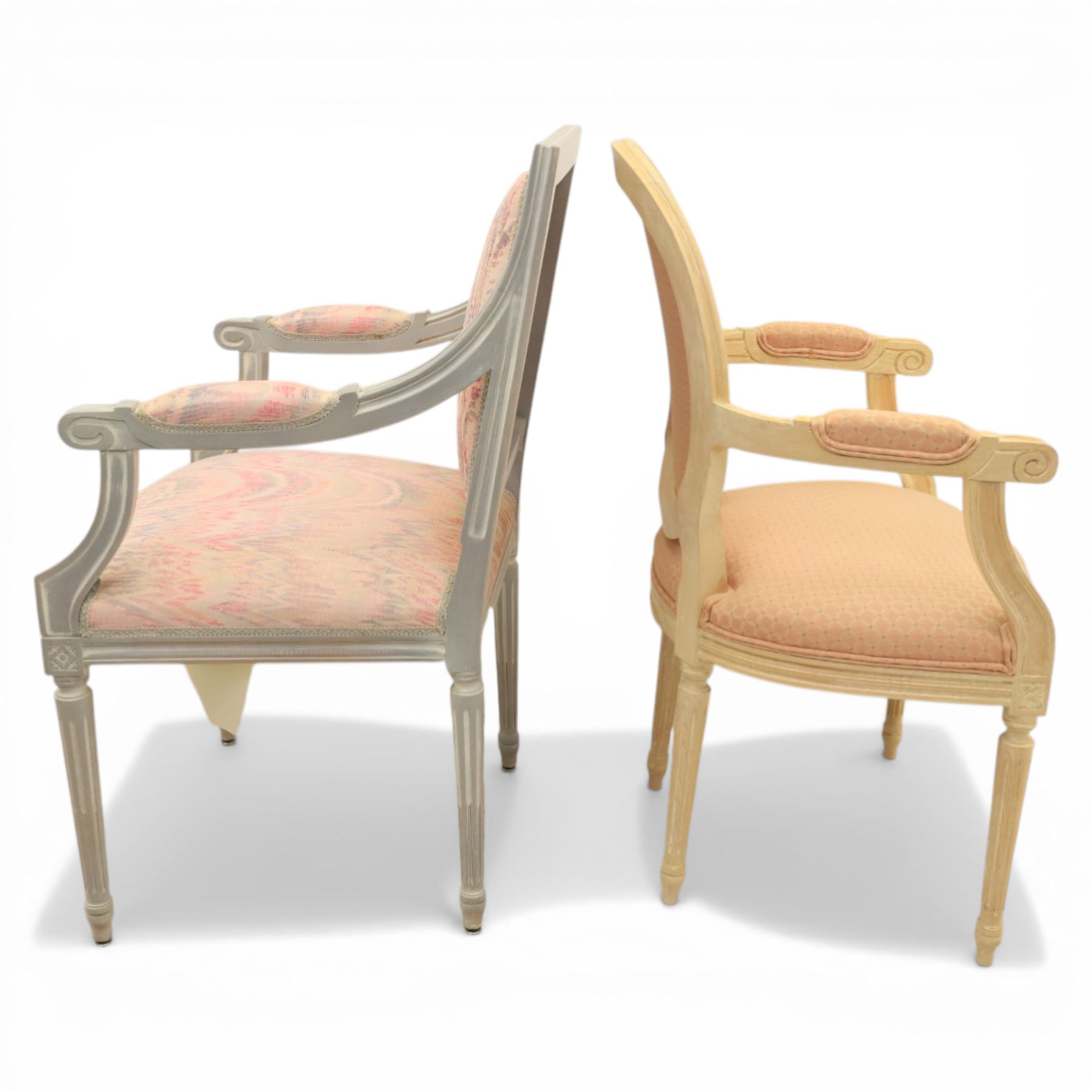 Set of two French design fauteuil armchairs upholstered in pink fabric, one with oval medallion back and padded arms on fluted tapering supports (H 97cm, W 58cm, D 54cm), the other with rectangular padded back, scroll arms and fluted tapering supports (H 99cm, W 60cm, D 60cm)