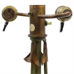 Arts and Crafts wrought iron and copper standard lamp, the openwork stem centred by a cut-glass reservoir with arrow-cut decoration, applied with stylised copper leaves, on shaped tripod base