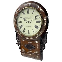 Joseph Critchley of Liverpool -  early 19th century twin fusee 8-day rosewood and mother of pearl inlaid drop-dial wall clock c1820, inlaid circular wooden dial surround with carved ears representing grapes and vine leaves, glazed box with a scroll carved surround, curved base and pendulum adjustment door, 14” painted dial with Roman numerals, minute track, and pierced steel hands within a cast brass bezel and flat glass, dial pinned to a four pillar chain driven fusee movement striking the hours on a bell. With pendulum and key.