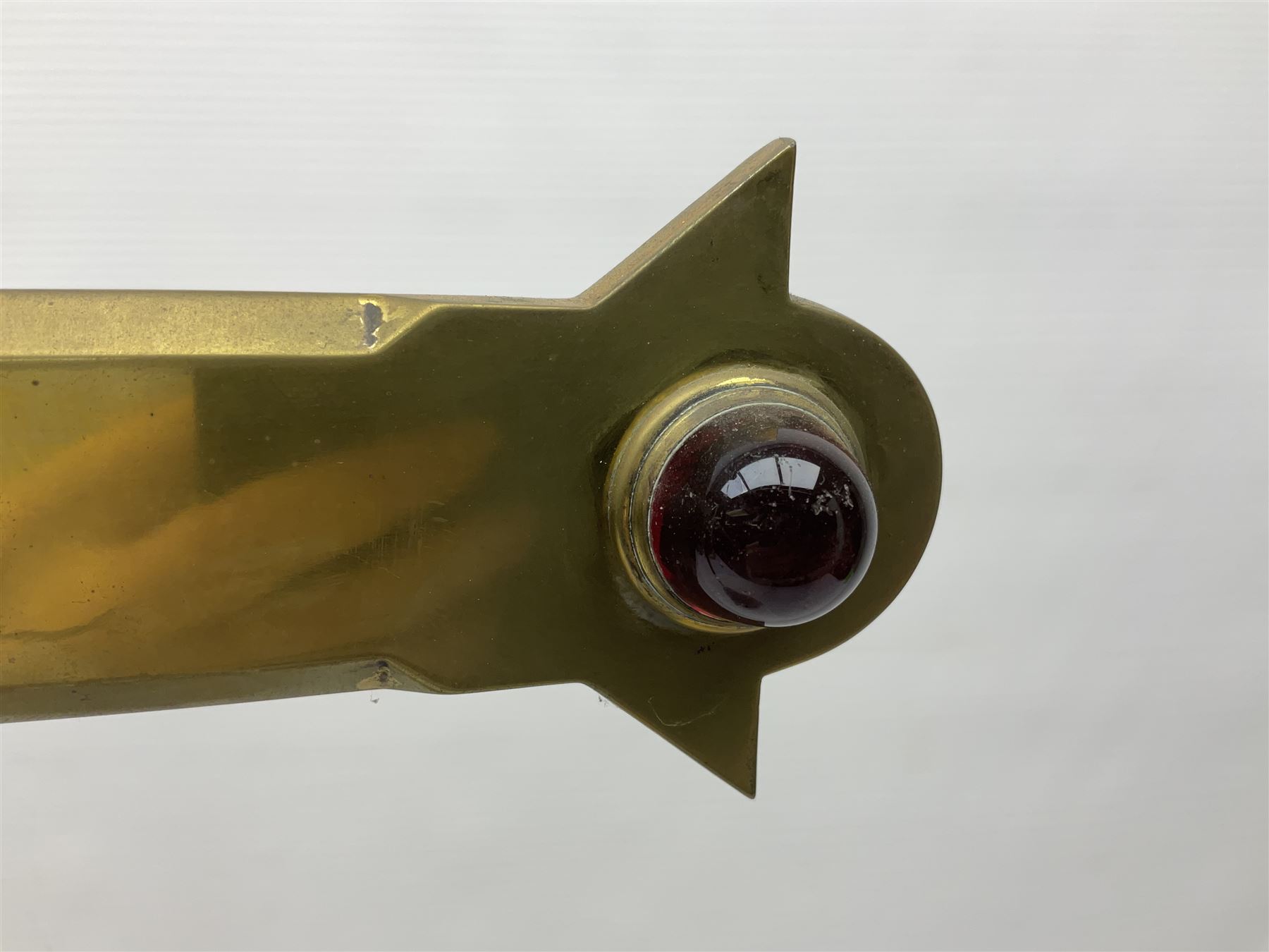 Brass alter cross, decorated with glass cabochons, upon a acicular stepped base and three claw feet, H73cm 