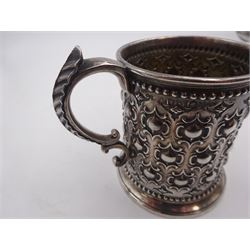 Victorian silver christening mug, with repousse and chased scroll and bead decoration, lozenge shaped cartouche engraved with monogrammed initials and acanthus capped C scroll handle, hallmarked Robert Hennell III, London 1861, H9.3cm