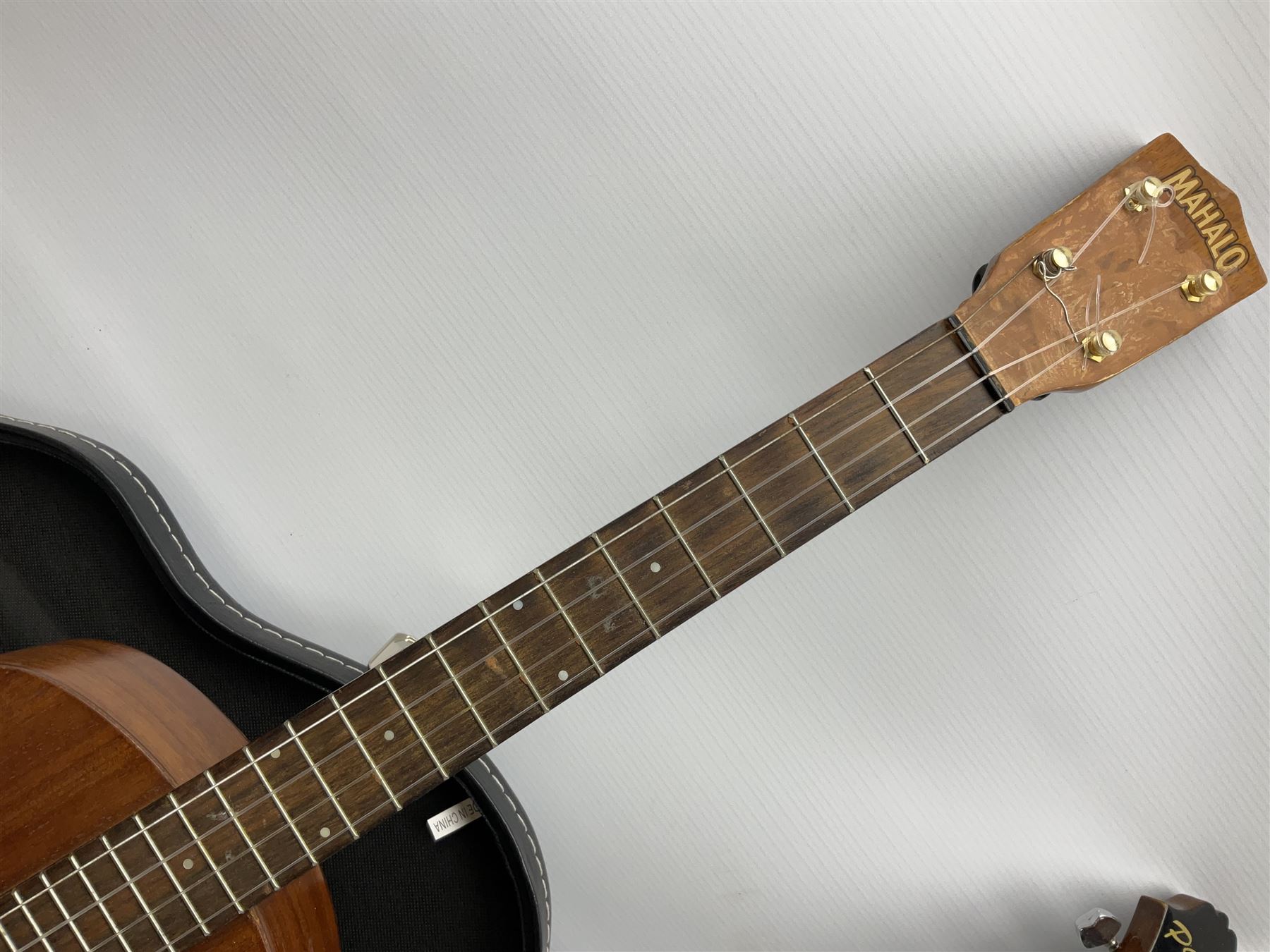 Palmer eight-string mandolin with mahogany back, simulated ivory and mother-of-pearl mounts L67cm; and Mahalo mahogany cased baritone scale ukulele, model no.U320B, L76cm; in hard carrying case (2)