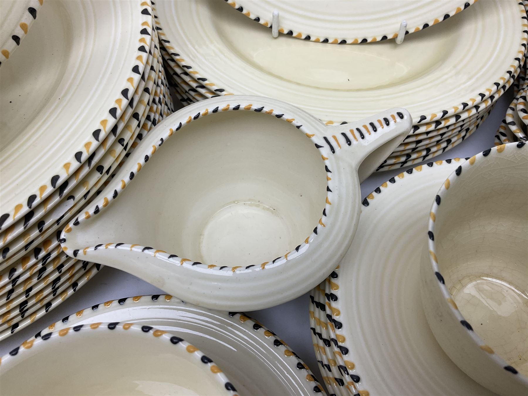 Art Deco Crown Ducal tea and dinner wares, reg no. 784158, comprising dinner plates, teacups, saucers, coffee cups, crescent shaped side plates, bowls, eggcups, etc, (93)