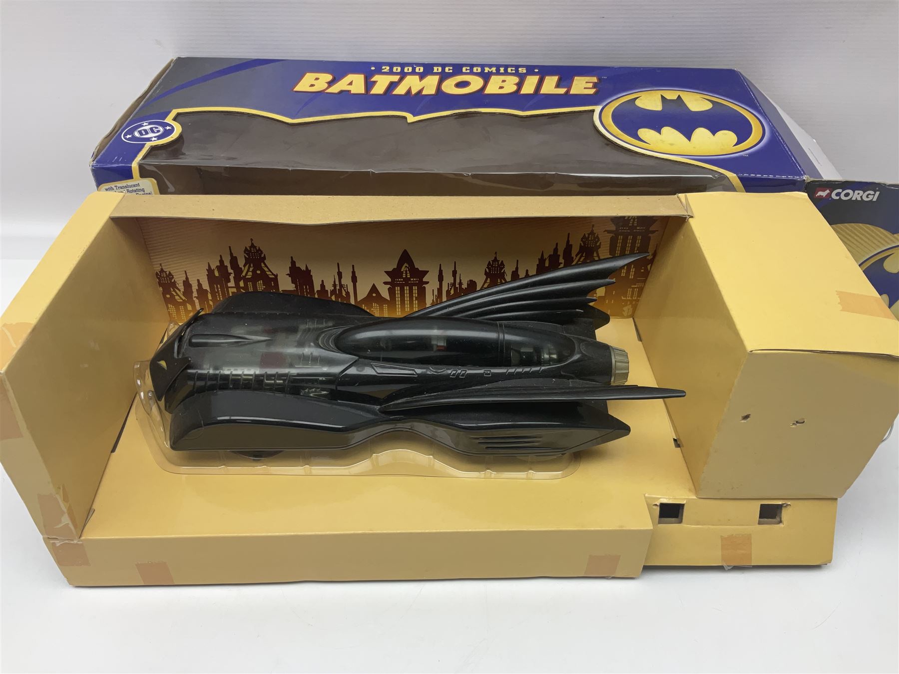 Five Corgi Batmobile die-cast vehicles from the DC Comics collection, to include 1940’s DC Comics BMBV2 1:18 and BMBV1 1:24 scale Batmobiles, all in original boxes 