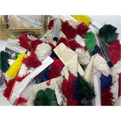 Quantity of military horse hair plumes and feather hackles, cloth stripes and regimental titles etc