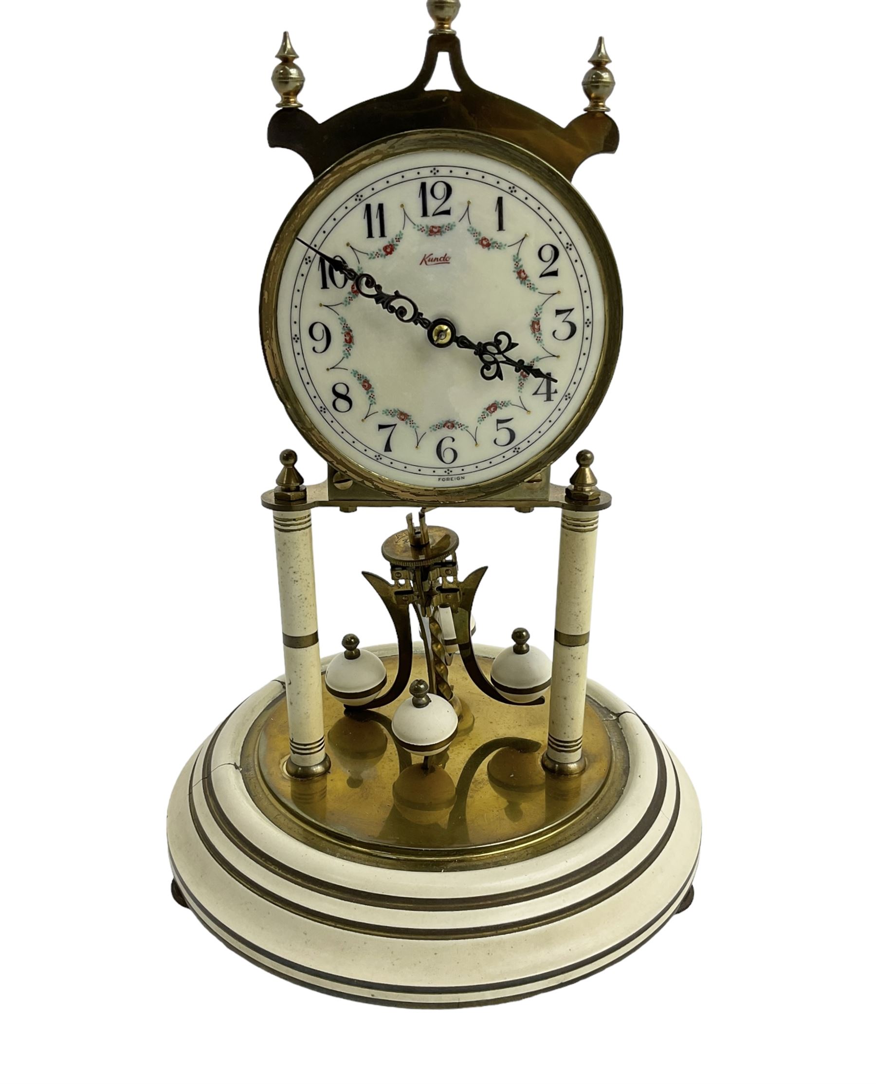Mid-20th century Kundo torsion clock - Keininger & Obergfell German 400-day clock with a glass dome , enamel dial and pierced steel hands, arabic numerals and floral swags, movement supported by two pillars on a painted circular base, torsion suspension intact, with key.
