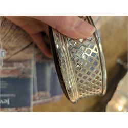 Two silver mounted bottle coasters, the larger example with latticework sides, hallmarked Mappin & Webb Ltd, Birmingham 1993, the smaller example with pierced sides, hallmarked W I Broadway & Co, Birmingham 1998, largest D12cm