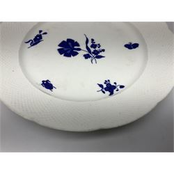 Three 19th century plates, comprising two circular examples and one oblong, each with osier moulded sides, the centres decorated in underglaze blue with Gillyflower type pattern, circular examples D25cm oblong example W27cm